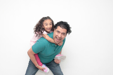 Fototapeta premium 40-year-old divorced single dad and his Latina daughter play and have fun to celebrate Father's Day