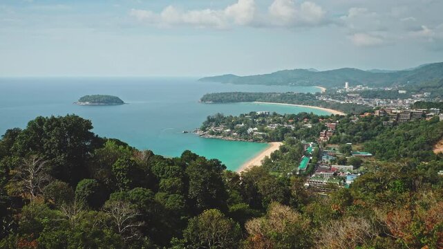 Phuket island coastline panorama of Kata beach, or Kata Noi beach, and Karon beach with turquoise ocean water, small island and lush green hills. Travel to tropical paradise. Aerial view drone flight