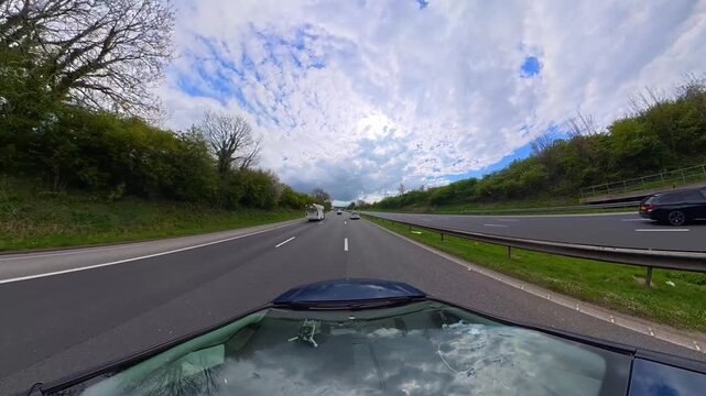 Ultra Wide Time Lapse. Car Travel on British Highways During Mostly sunny Day. Car Mounted Camera View of British Road Travel and Traffic on British Motorways and Highways of England Great Britain
