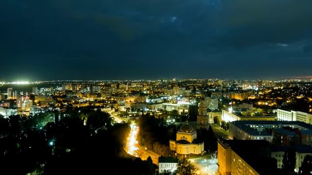 Lipetsk, Russia. Cathedral of the Nativity of Christ and historic city center, Drone footage at twilight with golden streetlights illuminating the skyline. Drone footage