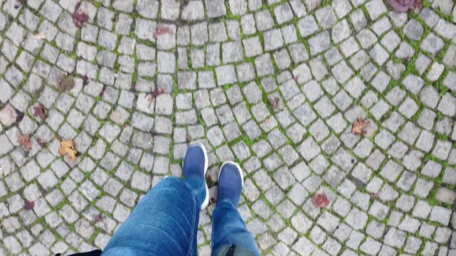 Walking on stone pavement in a city area
