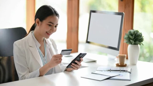Digital Payment Process with Credit Card and Smartphone in Modern Office | Mobile Banking and Online Shopping Experience with Financial Technology