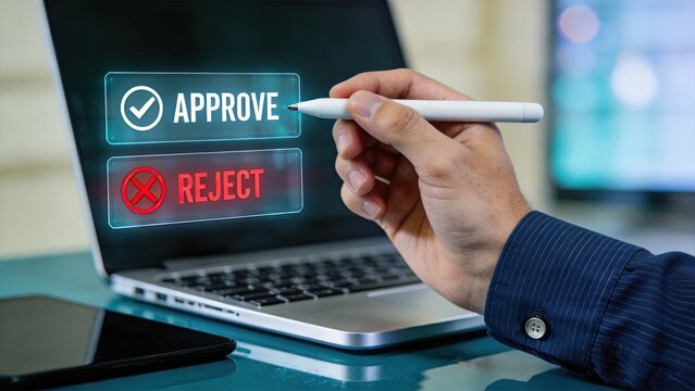 Hand holding stylus pen selecting approve or reject button on laptop screen, digital decision making process, authorization and verification concept for business workflow.