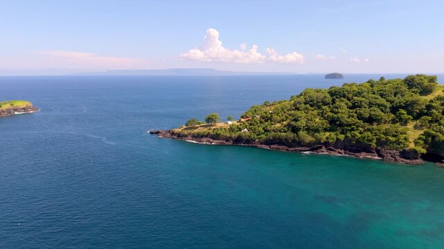 Aerial View of Tropical Peninsula and Turquoise Sea at Bukit Asah Cliff in Bali, Indonesia