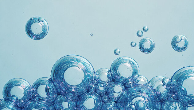 abstract blue soap bubbles floating on clean light background with transparent liquid texture and minimalist macro design concept