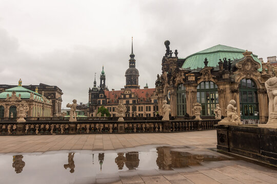 Zwinger Courtyard Reflection in Rain Puddle on Stone Terrace