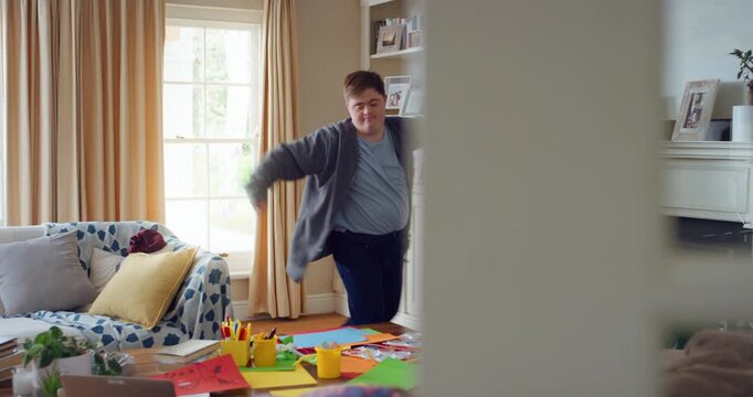 Man, dancing and rhythm for fun at house with energy, playful rehearsal and practice session. Home, dancer and freestyle with movement, choreography and male person with down syndrome for theatre art