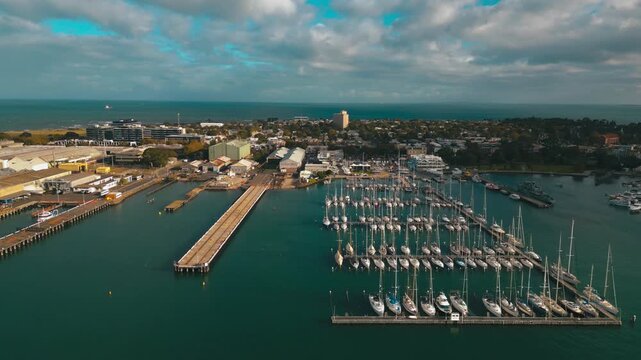 Cinematic 4K drone footage capturing Gem Pier, yachts, HMS Castlemaine, and the Williamstown waterfront under sunny afternoon skies.