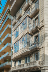 Obraz premium Barcelona Modernist Architecture Building Facade, Ornate Balconies, Traditional Shutters,