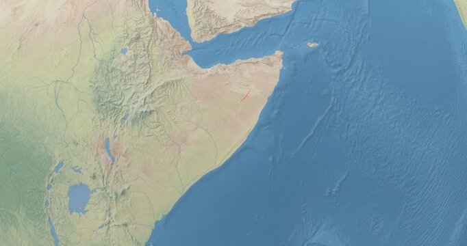 Somalia on Globe. Zoom into the country with Earth spinning on dark background. Physical world map with Somalia and label on it. Country view animation.