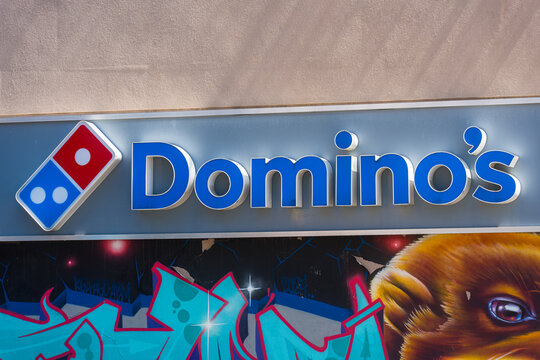 Toronto, Canada - April 17, 2026: City storefront showcasing vibrant street murals. Graffiticovered shopfront with neon