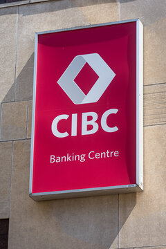 Toronto, Canada - April 17, 2026: Detailed shot of CIBC bank sign on building facade showing textured surface and soft