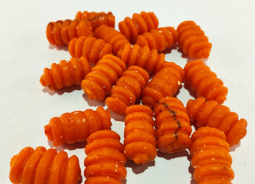 Pile of Crunchy Orange Spiral Corn Snacks
