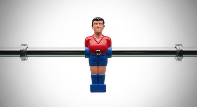 Close up of a single foosball player figure on a metal rod against a white background.