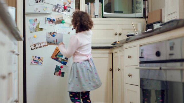 Eating, energy and child with wand for playing, creative imagination or spin for spell in home. Snack, happy kid or playful with magic toy in kitchen for pretend wizard, development or healthy growth