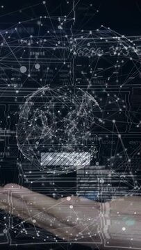 Vertical video: Arm sliding in from left causing mesh globe forming above palm, HUD mapping data