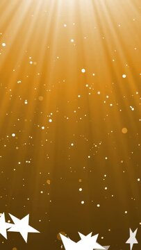 Vertical video: Light rays lighting starfield, sparks falling stars drifting for warm mood