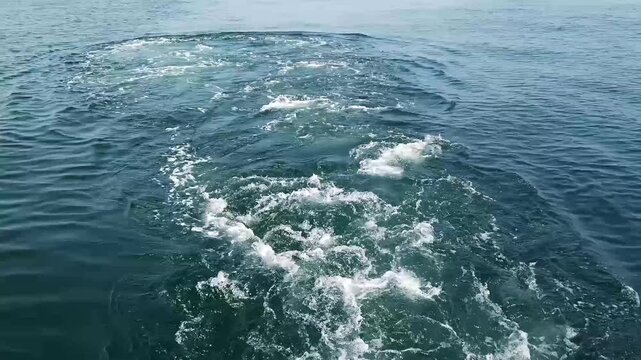 Vessels propeller wash when accelerating.