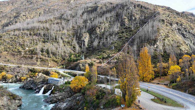 Aerial View of Kawarau River with Hydroelectric Station and Autumn Foliage