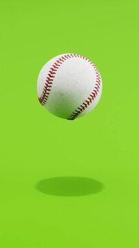Floating Baseball Ball Spinning on Green Background with Copy Space, Vertical Seamless Loop 3D Animation