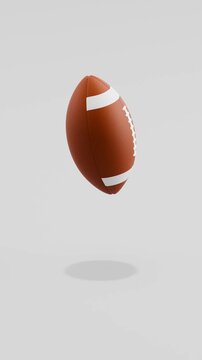 Floating American Spinning Ball Floating on Gray Background with Copy Space, Vertical Seamless Loop 3D Animation