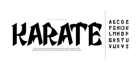Karate: A bold martial arts display font. Sharp oriental calligraphic typeface for Asian-themed logos, gaming, and dojo branding. © Ook.Arsho