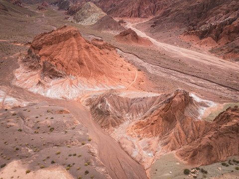 Aerial view of colorful eroded desert mountains