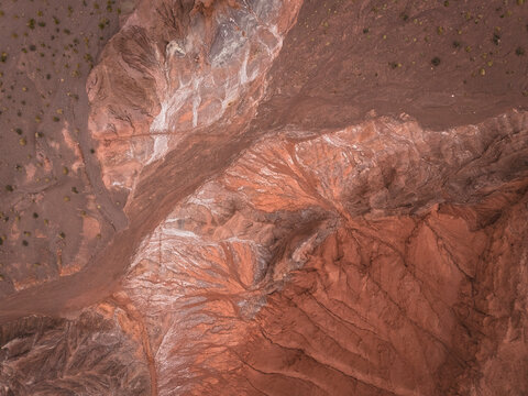 Aerial view of eroded red desert landscape