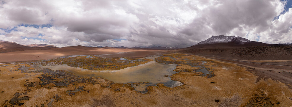 Dramatic cloudy sky over high altitude desert wetlands