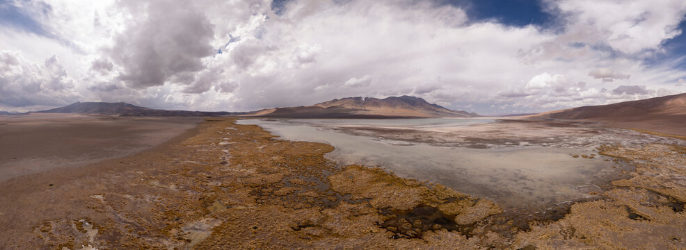 Expansive mountain valley with a shallow desert lake