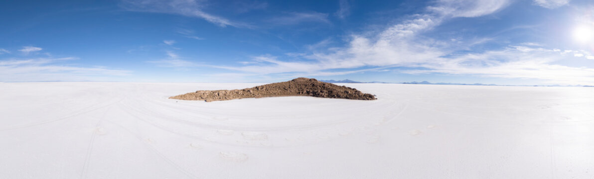 A rocky island in an endless white salt desert