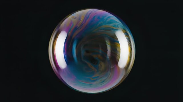 Soap bubble with ocean wave reflection floating against dark background. Distorted liquid sphere surface swirling with iridescent colors and circular movement