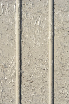 A close up texture background of white fiberglass panel showing visible glass fibers and two vertical lines.