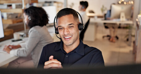 Obraz na płótnie Canvas Computer, headset and man consulting in call center for language translation, help desk or faq. Coworking, tech or happy consultant at work for customer service, multilingual support or online advice