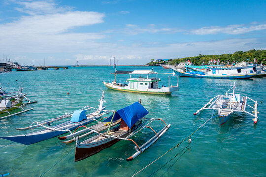 Fishing boats in Bira harbor, Sulawesi, Indonesia on clear day