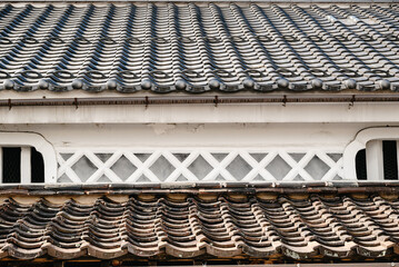 Layered Japanese Roof Tiles and Plaster Wall Texture Detail © Shohei Kannauchi