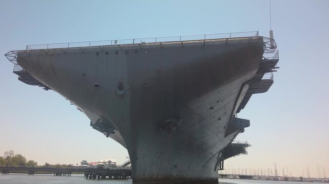 Gimbal shot from a moving boat passing underneath the USS Yorktown aircraft carrier at Patriots Point in Charleston, South Carolina. 4K