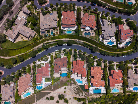 Overhead drone shot of symmetrical luxury houses and winding streets in Newport