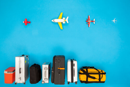Row of luggage with airplanes