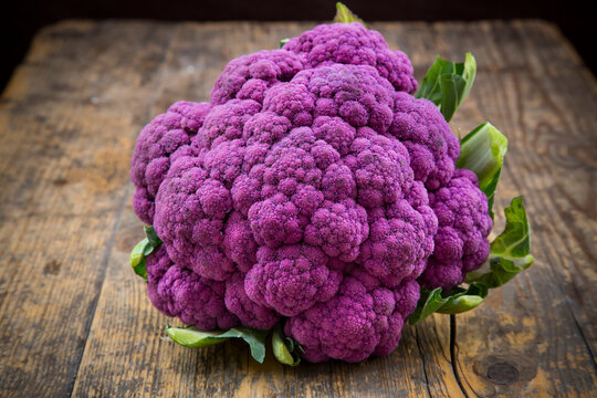 Purple cauliflower on wood