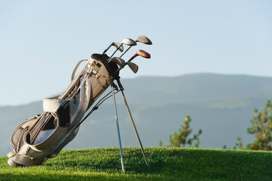 Italy, Kastelruth, Golf clubs in golf bag on golf course