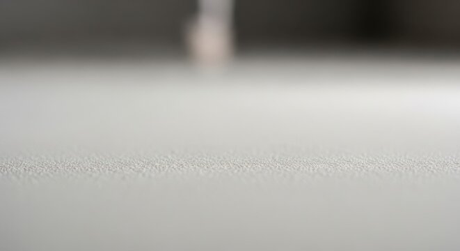 Close-up macro shot of textured drywall surface in a construction setting