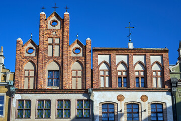 fragment of the facade of historic tenement houses in Poznan © GKor