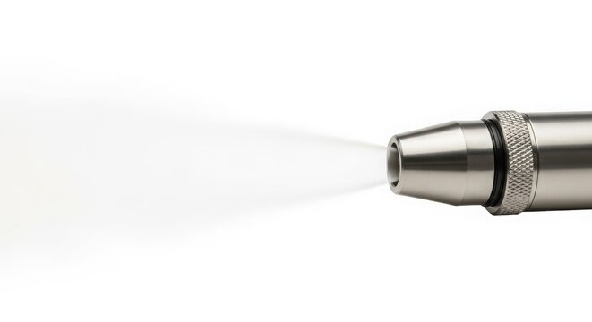 Metallic nozzle releasing a fine mist of air, showcasing precision engineering and industrial application.