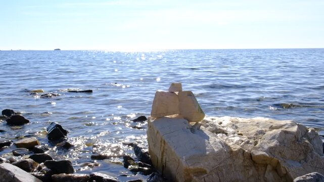 Dreamy scenery. Calm sea, tranquil ethereal view. Surreal. Stone stage. Empty template for text or presentation. Harmony, relax, meditating, mental health concept. Pure water with reflections sunlight