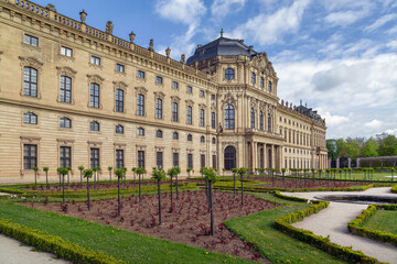 Fototapeta premium Wurzburg Residence facade view from the court garden in Wurzburg, Germany. Exterior perspective on a sunny day