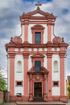 St. Vitus church in Veitshochheim, Germany. Front facade low angle view under a cloudy sky