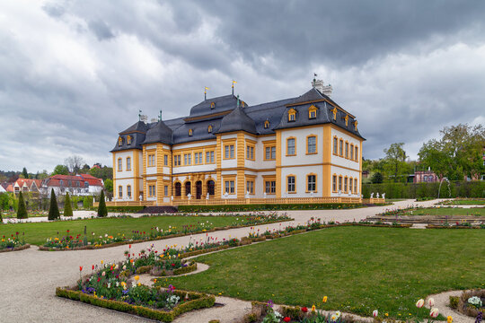 Veitshochheim Palace facade view in Veitshochheim, Germany. Exterior perspective of the historic building under an overcast sky