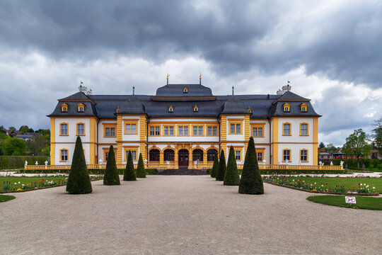Veitshochheim Palace facade view in Veitshochheim, Germany. Exterior perspective of the historic building under an overcast sky
