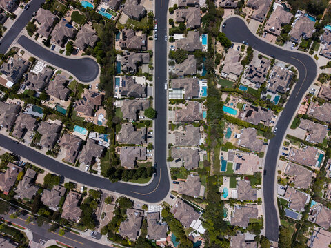 Top down drone shot of desert landscape residential cul-de-sacs and pools